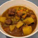 Hearty Soup, filled with Beef chunks, carrots, potatoes, peas, and onions, in a savory sauce.