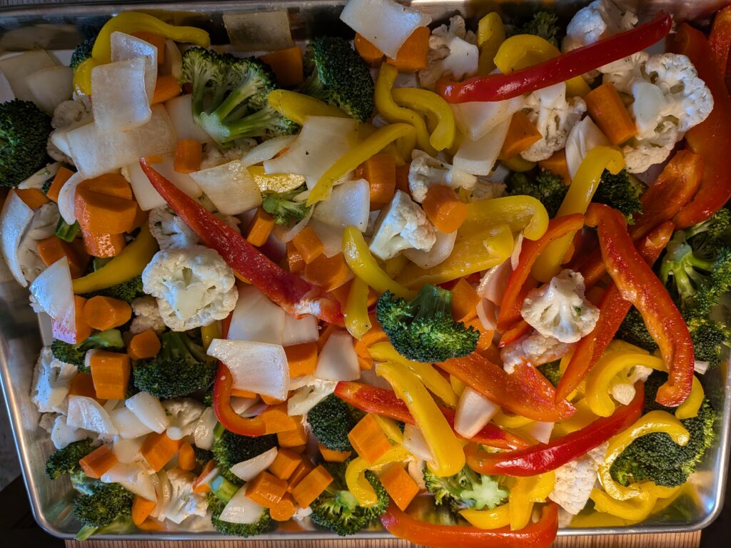 Oven Roasted Veggies all veggies on a cookie sheet