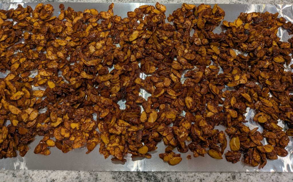 almonds laying on tin foil to cool