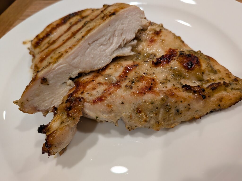 Garlic Herb and Wine flavored chicken on the grill... cooked to perfection. Guaranteed to leave your mouth watering.