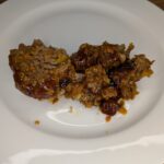 This homemade meatloaf recipe is tender, flavorful, and topped with a sweet and tangy glaze made from ketchup, brown sugar, and mustard. Made with ground beef, onions, bell peppers, and oatmeal.